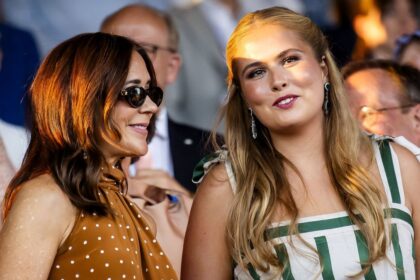 Queen Mary is all smiles in a chic polka-dot dress as Princess Amalia shines in white and emerald green