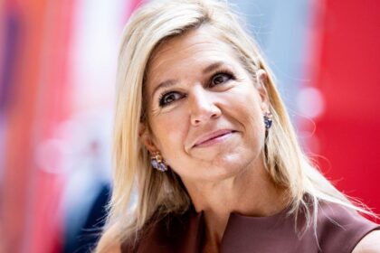 Queen Máxima steps out in chocolate brown and soft pink for an unexpected fall pairing in Amsterdam