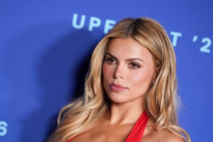 Brooks Nader turns heads in daring plunging red dress during glamorous Capri getaway