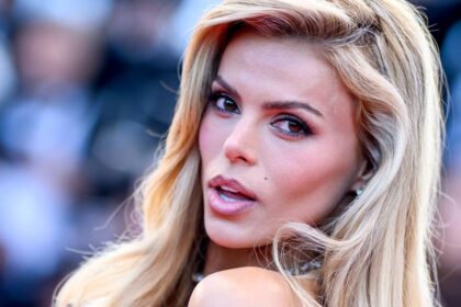 Brooks Nader is a Baywatch bombshell in ultra-plunging romper following Taron Egerton split