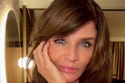 Helena Christensen, 57, sizzles in plunging black lace lingerie in striking new photos