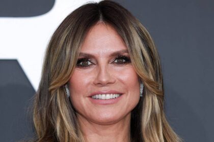 Heidi Klum, 53, turns heads in a plunging pink corset and lace blouse