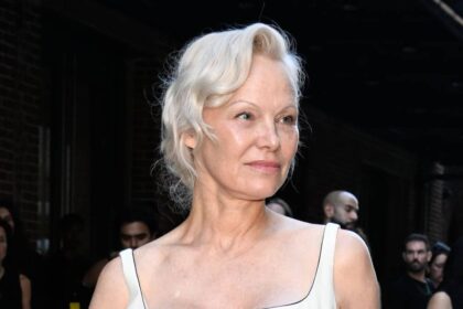 Pamela Anderson stuns in bridal figure-hugging gown