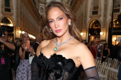 Jennifer Lopez gives classic denim a romantic twist with a sheer lace top and matching bralette