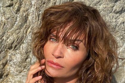 ’90s supermodel Helena Christensen, 57, stuns in plunging lace ‘naked’ dress at London Fashion Week