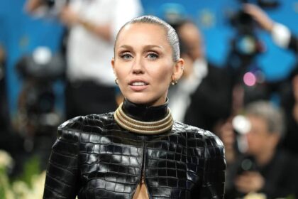 Miley Cyrus sizzles in daring ‘naked’ lace dress at wild party