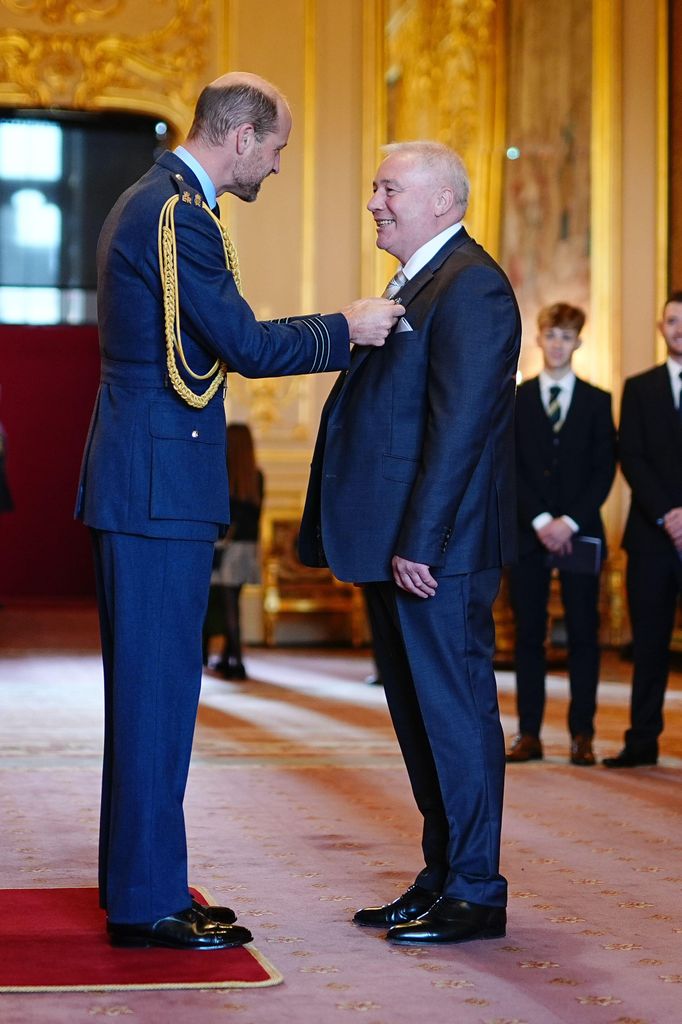 Alistair McCoist is made an Officer of the Order of the British Empire by the Prince of Wales 