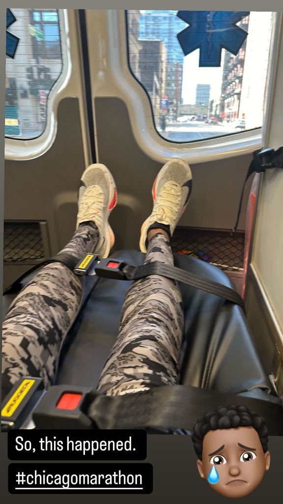 T.J. Holmes shares a photo from inside an ambulance on a stretcher after the Chicago Marathon, shared on Instagram Stories