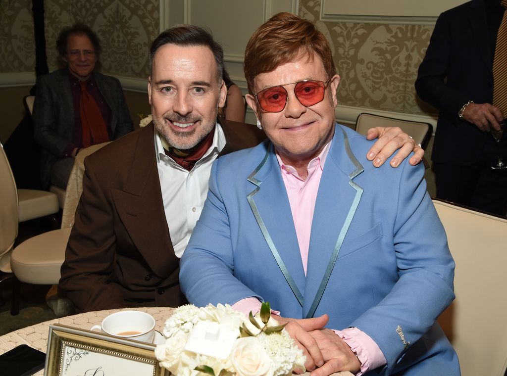 David Furnish sat with Elton John