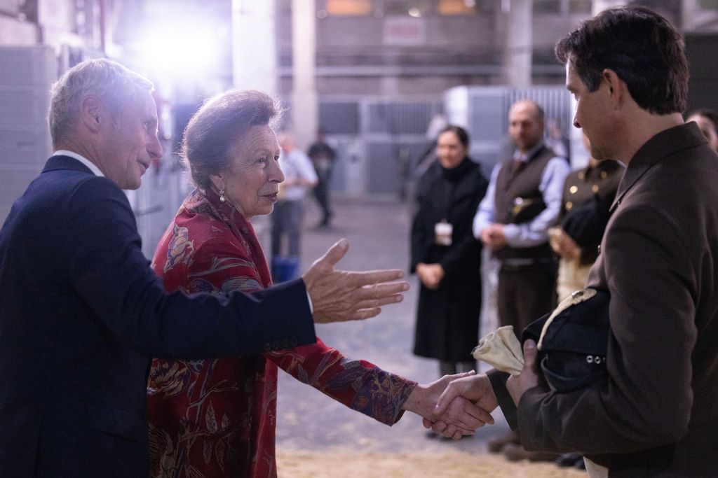 The Princess Royal shaking hands of riders