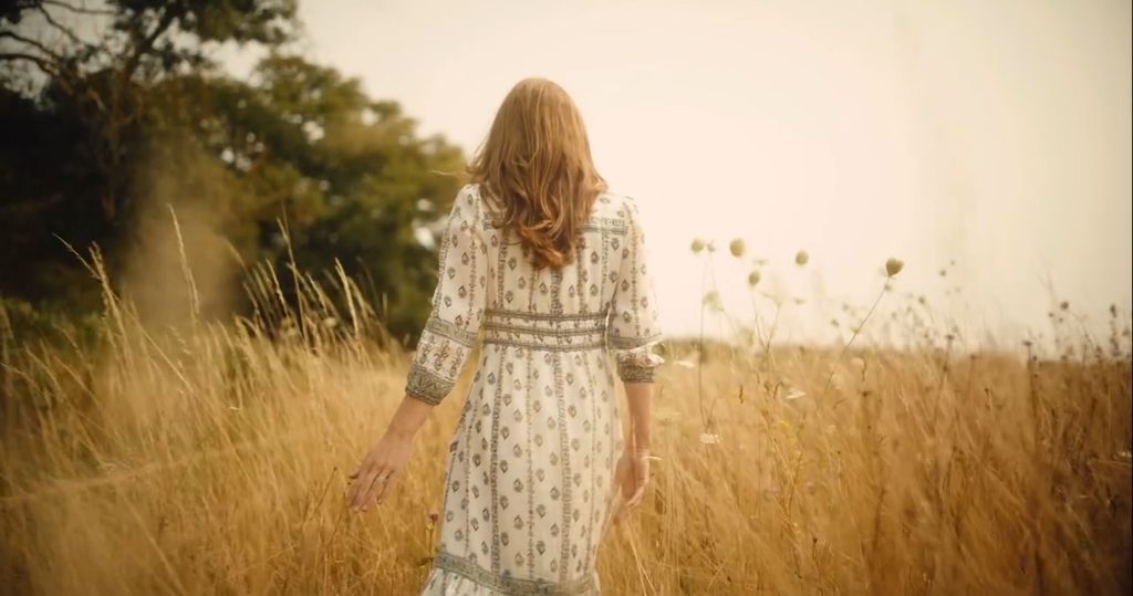 Kate Middleton walking through a field