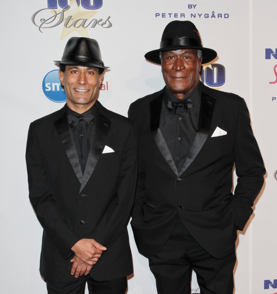 BEVERLY HILLS, CA - FEBRUARY 22: (L-R) K.C. Amos and John Amos attend the Norby Walters 25th annual night of 100 stars Oscar viewing gala at The Beverly Hilton Hotel on February 22, 2015 in Beverly Hills, California.  (Photo by Tibrina Hobson/WireImage)