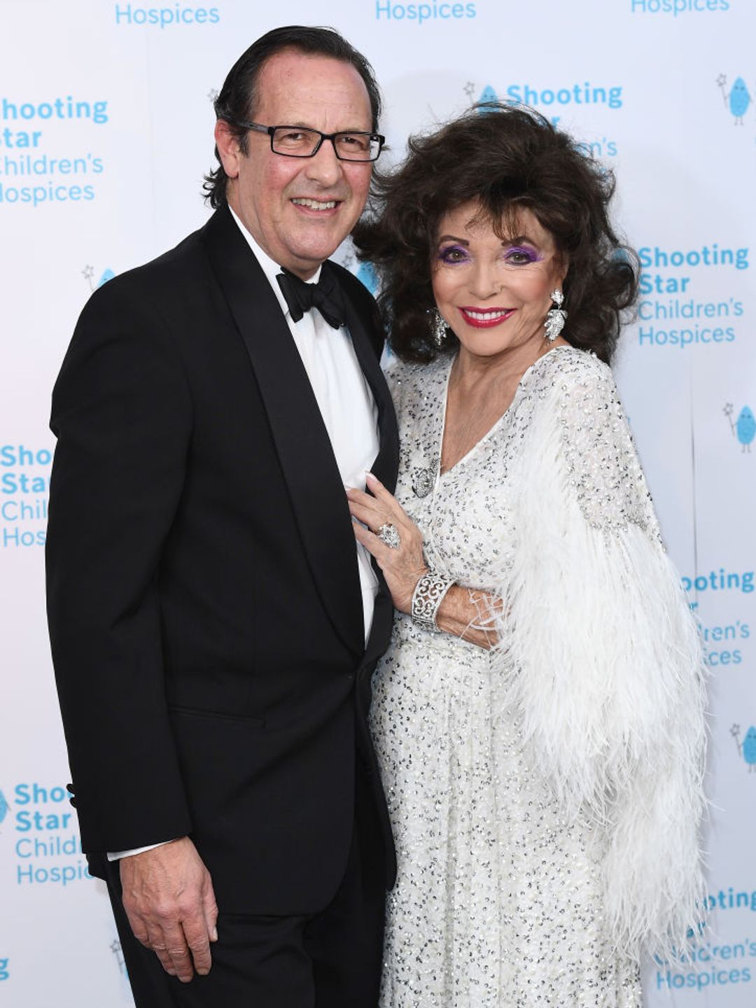 Percy Gibson and Dame Joan Collins attends the Shooting Star Ball in 2021. 