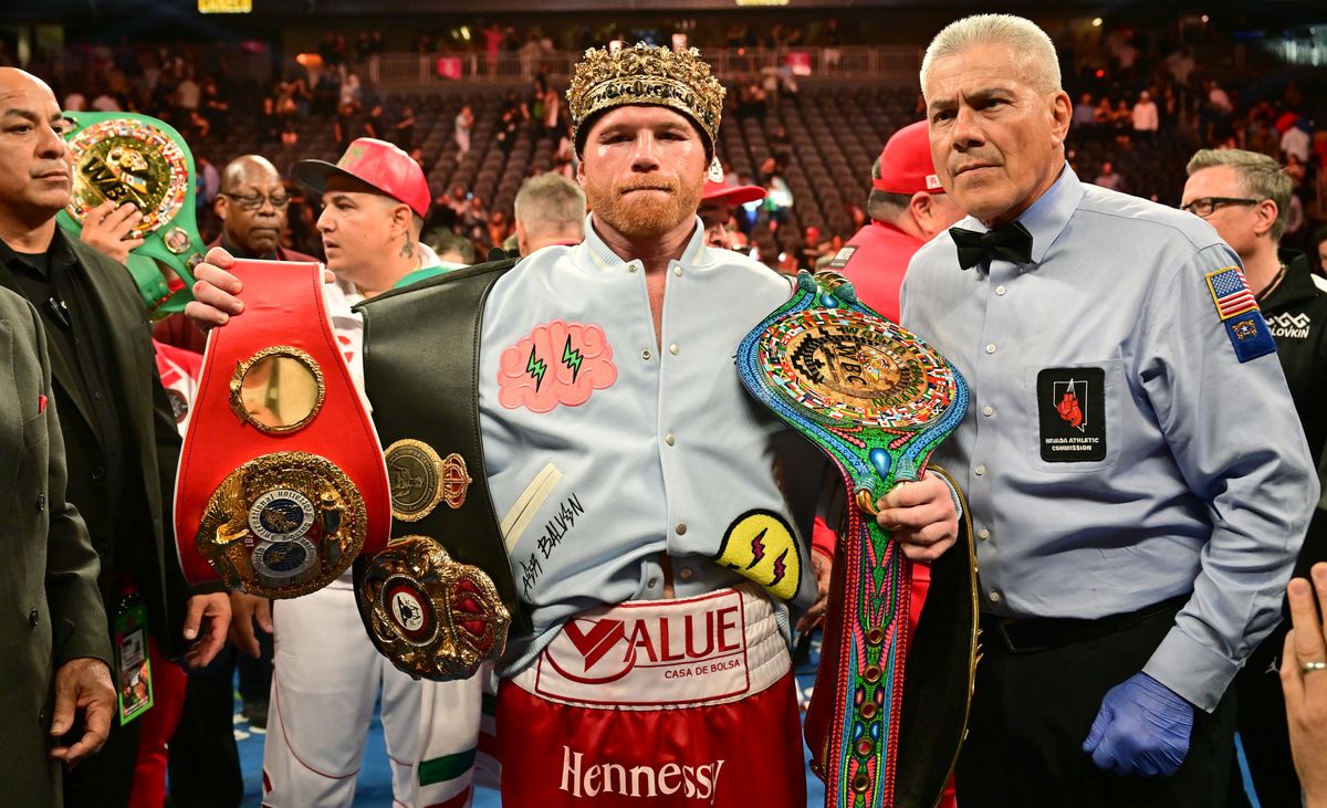 Mexican boxer Saul "Canelo" Alvarez poses with his belts and crown after defeating Kazakh boxer Gennady Golovkin to retain his undisputed super-middleweight crown at T-Mobile Arena in Las Vegas, Nevada, September 17, 2022. (Photo by Frederic J. BROWN / AFP) (Photo by FREDERIC J. BROWN/AFP via Getty Images)