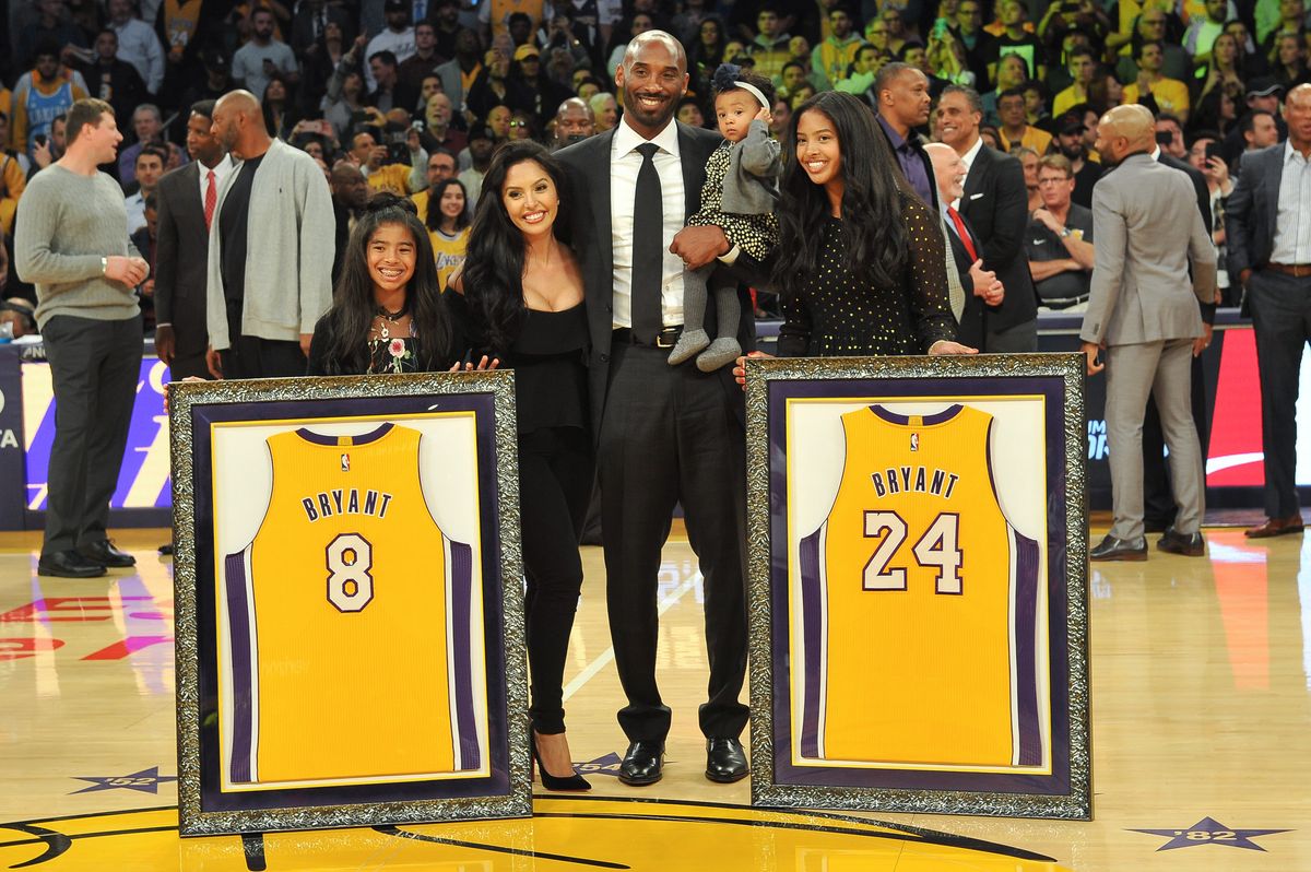 Kobe Bryant, wife Vanessa Bryant, and daughters Gianna Maria Onore Bryant, Natalia Diamante Bryant, and Bianka Bella Bryant attend Kobe Bryant's jersey retirement ceremony during halftime of a basketball game between the Los Angeles Lakers and the Golden State Warriors at Staples Center on December 18, 2017, in Los Angeles, California. 