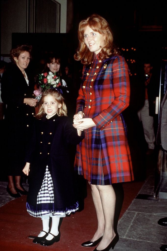 Princess Beatrice and Sarah Ferguson attending a carol concert in 1994