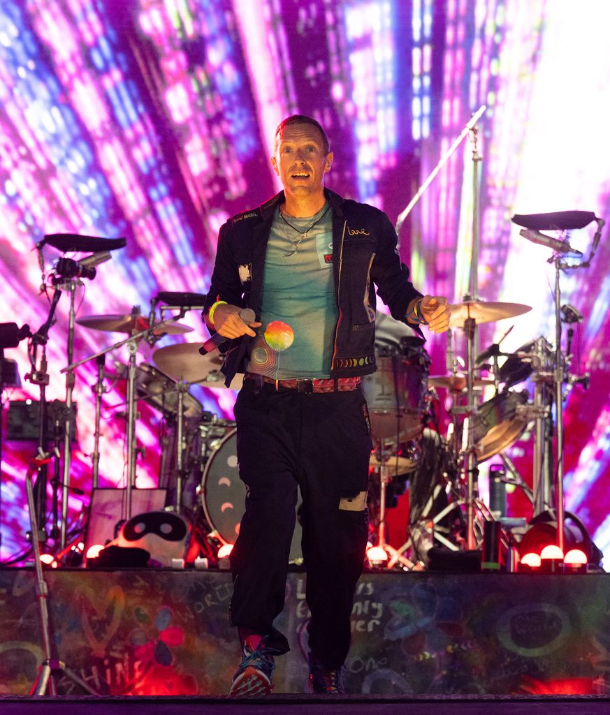 Chris Martin of Coldplay performs as the band headline the Pyramid stage during day four of Glastonbury Festival 2024