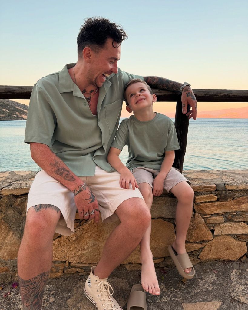 father on holiday with his son 