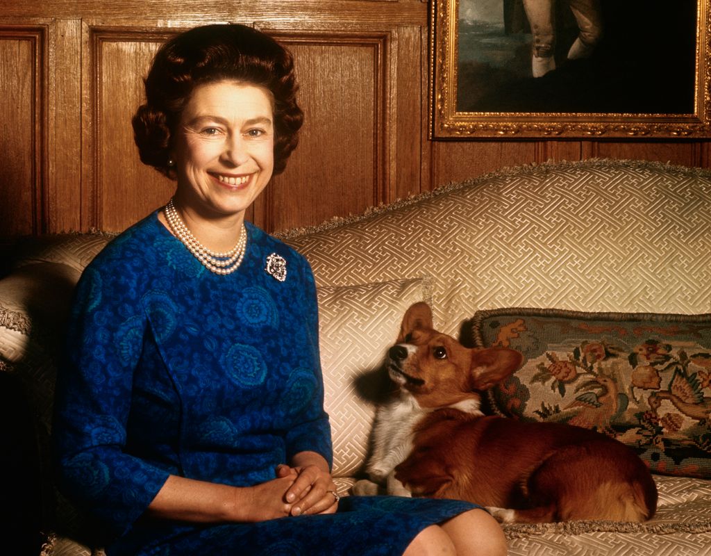 queen with pet corgi 