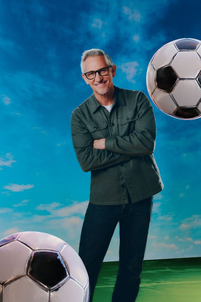 Gary Lineker in a green jacket with a background of footballs