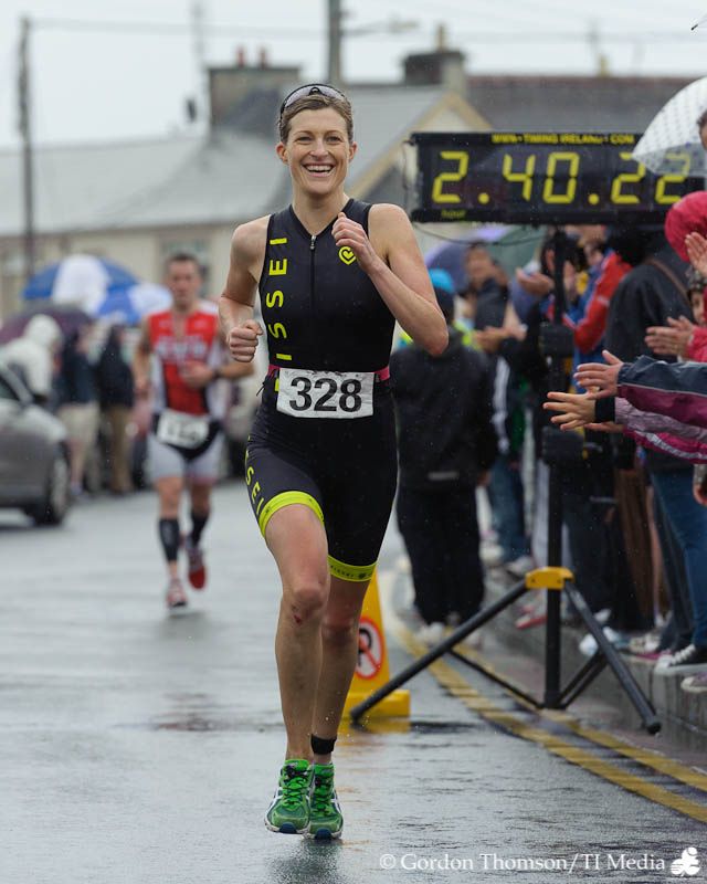 woman running in a race in the rain 