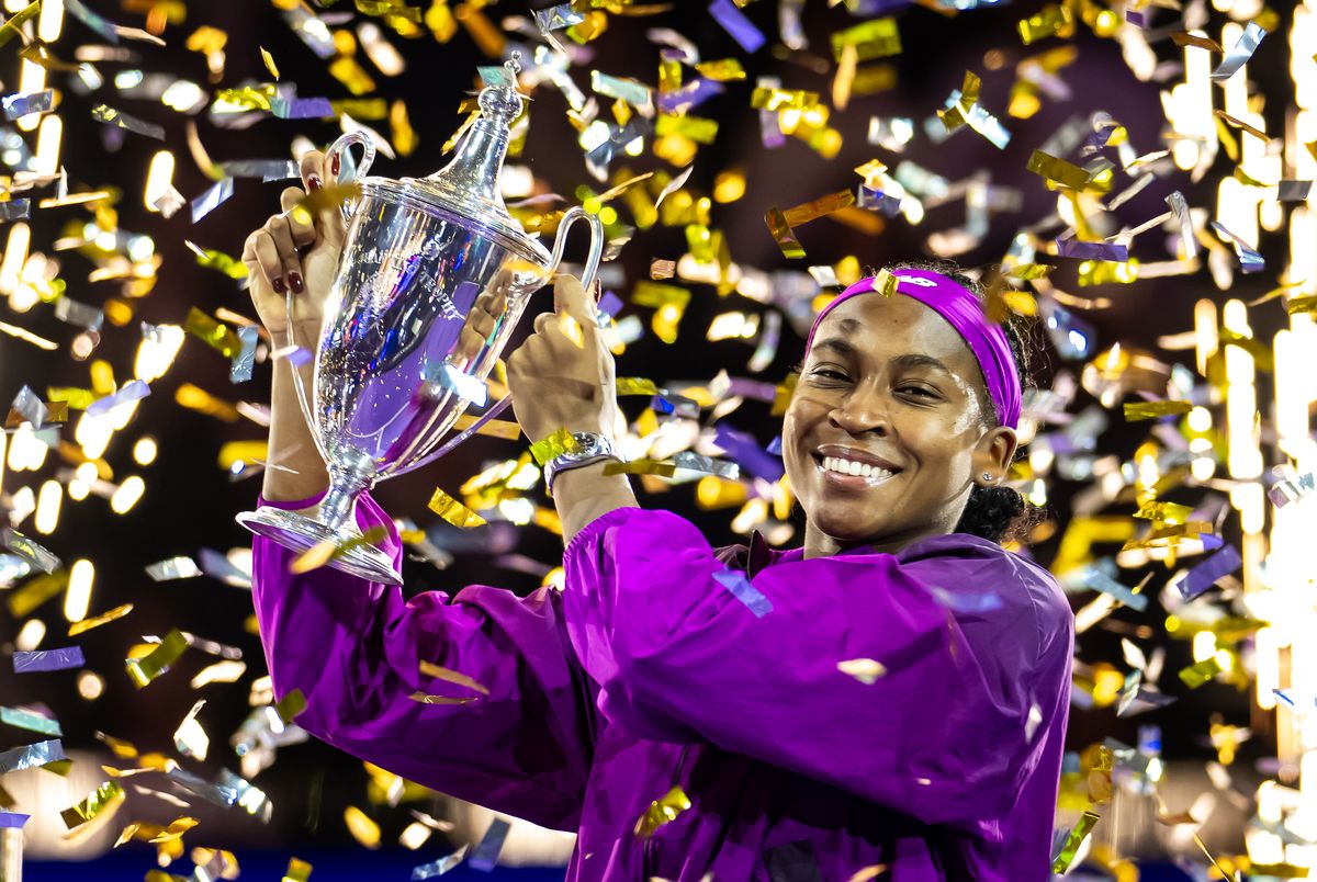 Gauff holding on to the Billie Jean King trophy at the WTA Finals 