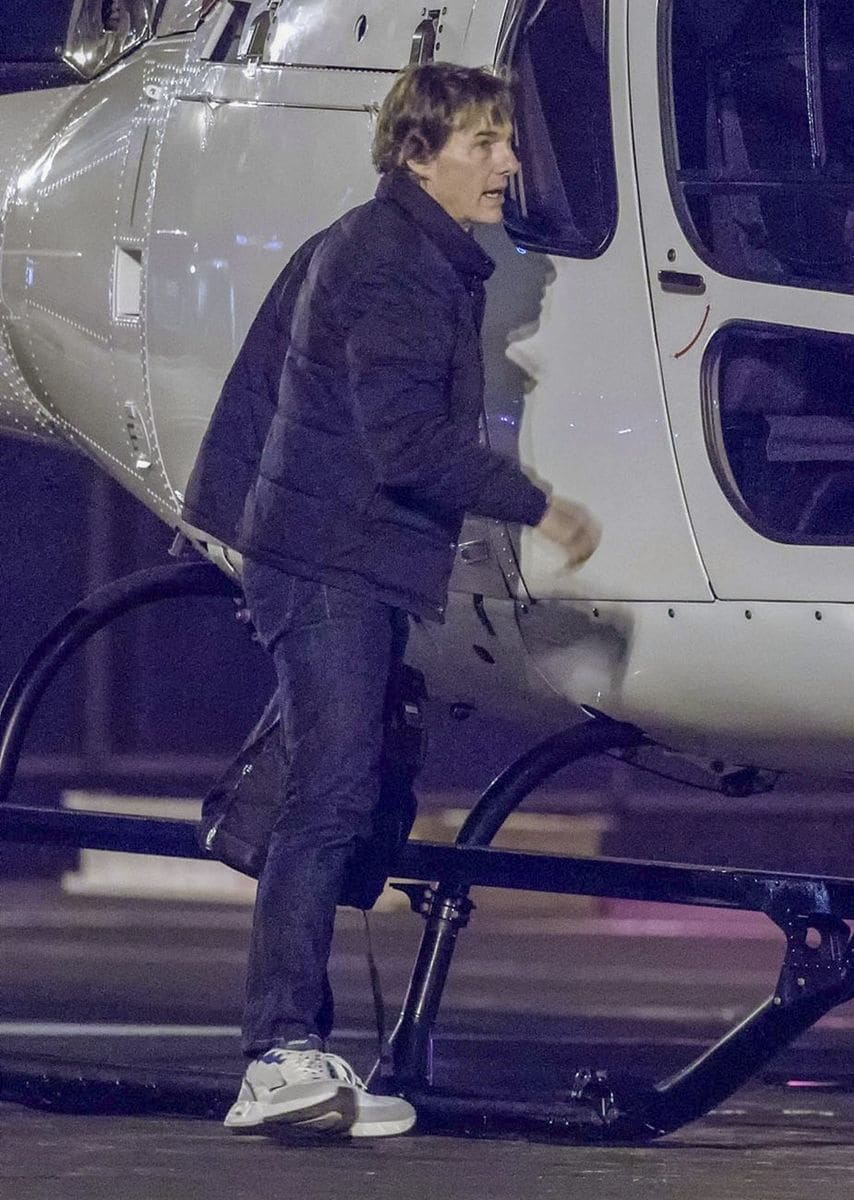 Tom Cruise exiting the helicopter