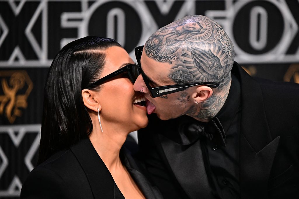 US socialite Kourtney Kardashian and husband US musician Travis Barker arrive for the 75th Emmy Awards at the Peacock Theatre at L.A. Live in Los Angeles on January 15, 2024. (Photo by Frederic J. Brown / AFP) (Photo by FREDERIC J. BROWN/AFP via Getty Images)