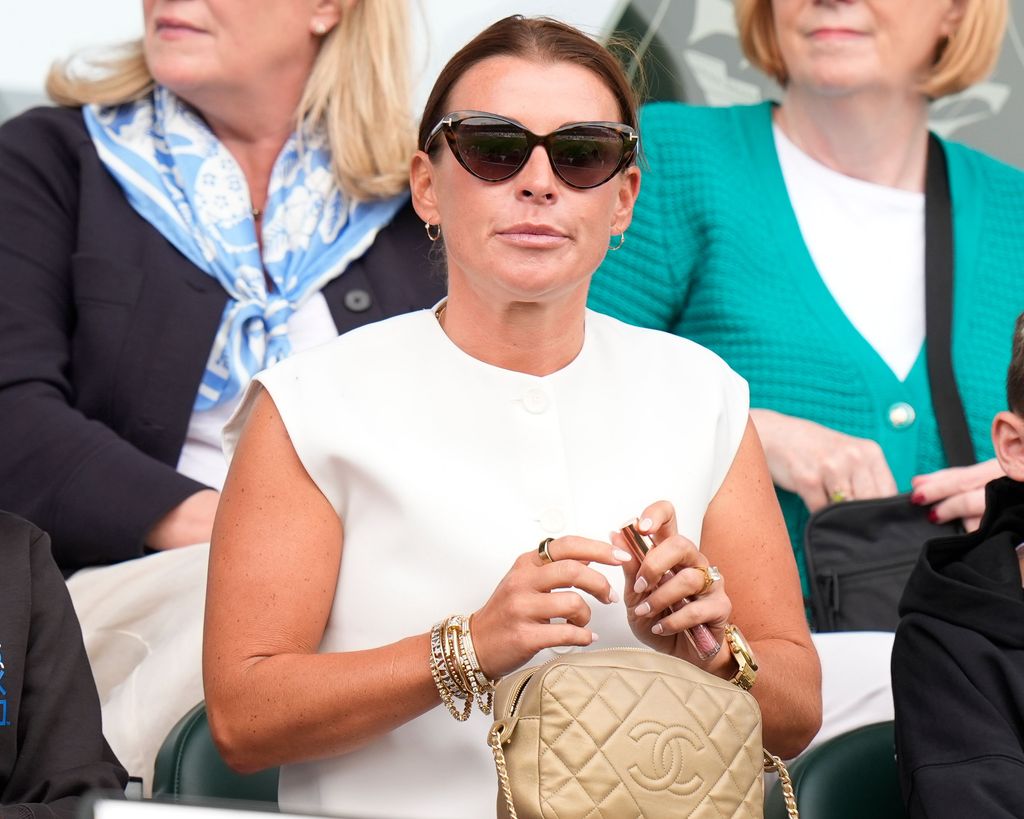 Coleen Rooney watching a football match