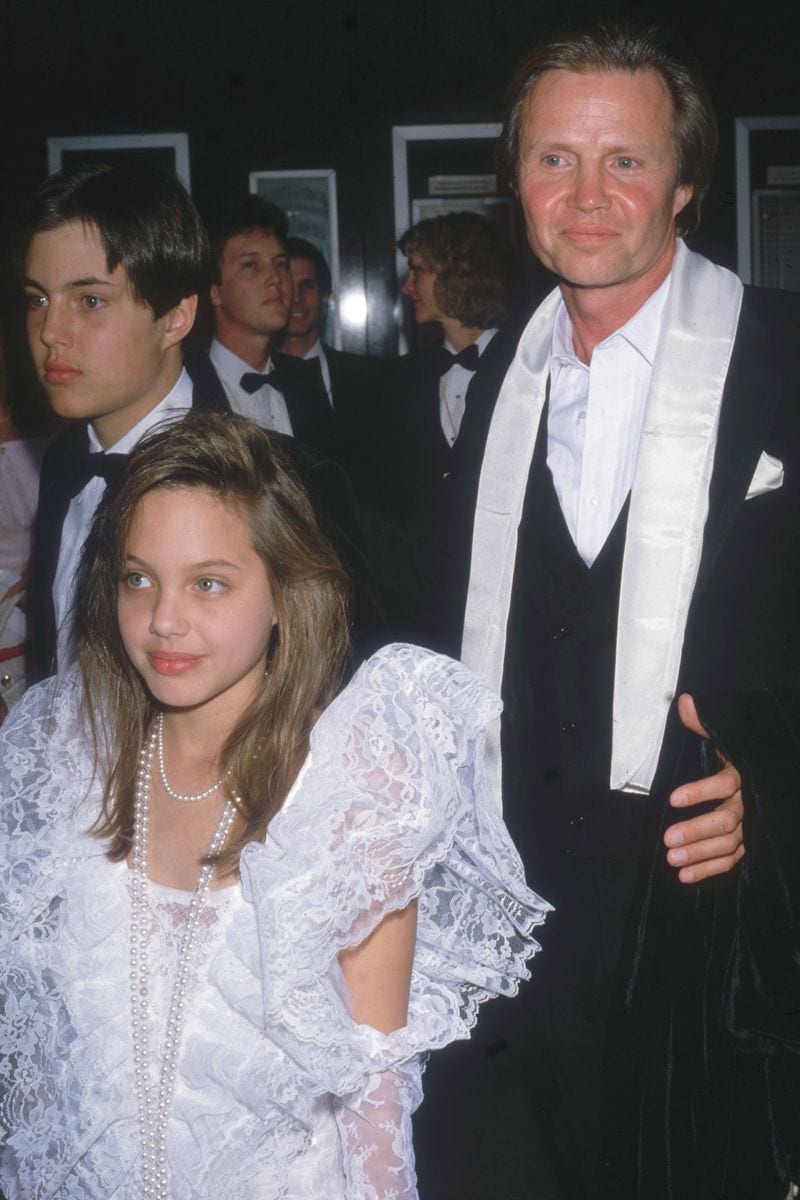 An 11-year-old Angelina with her dad Jon Voight, and her brother James