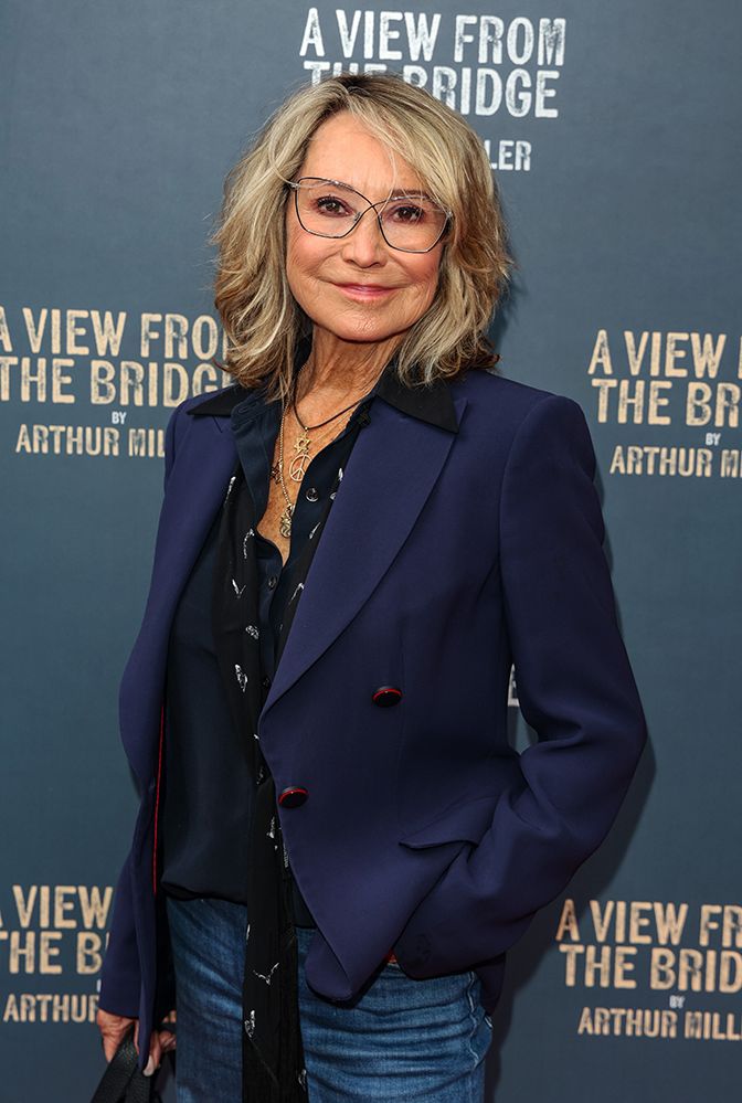 Felicity Kendal wearing a navy blazer and jeans 