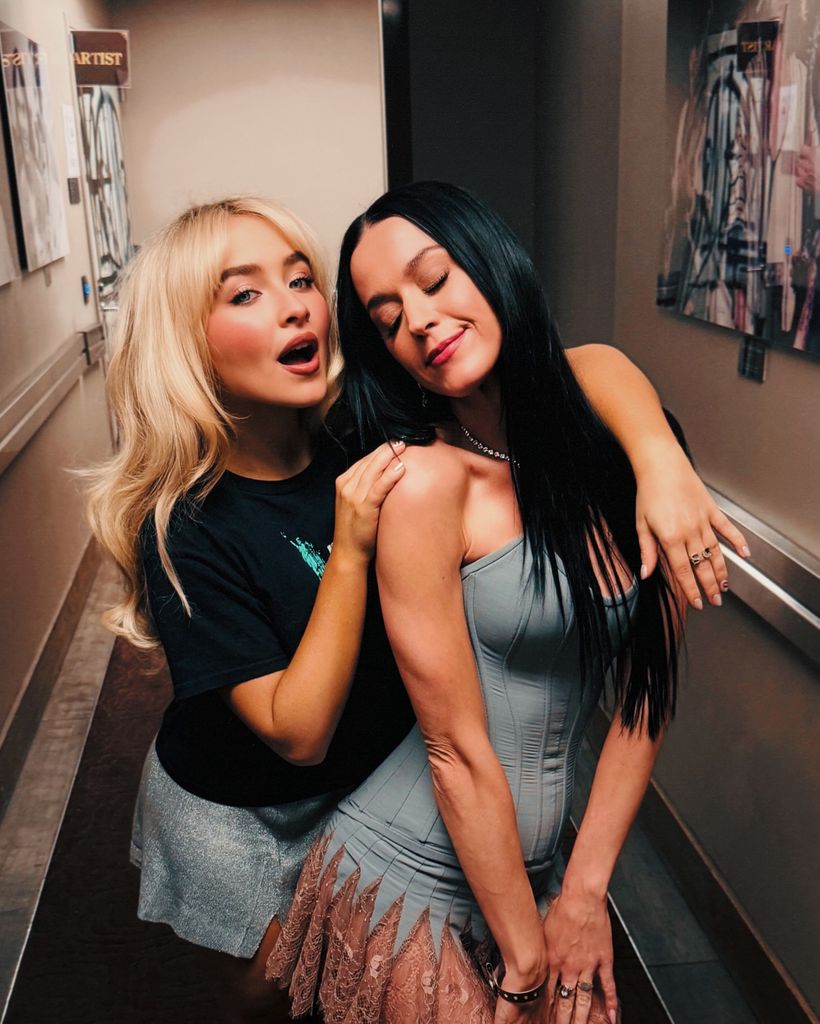 Katy Perry posing backstage with Sabrina Carpenter on tour