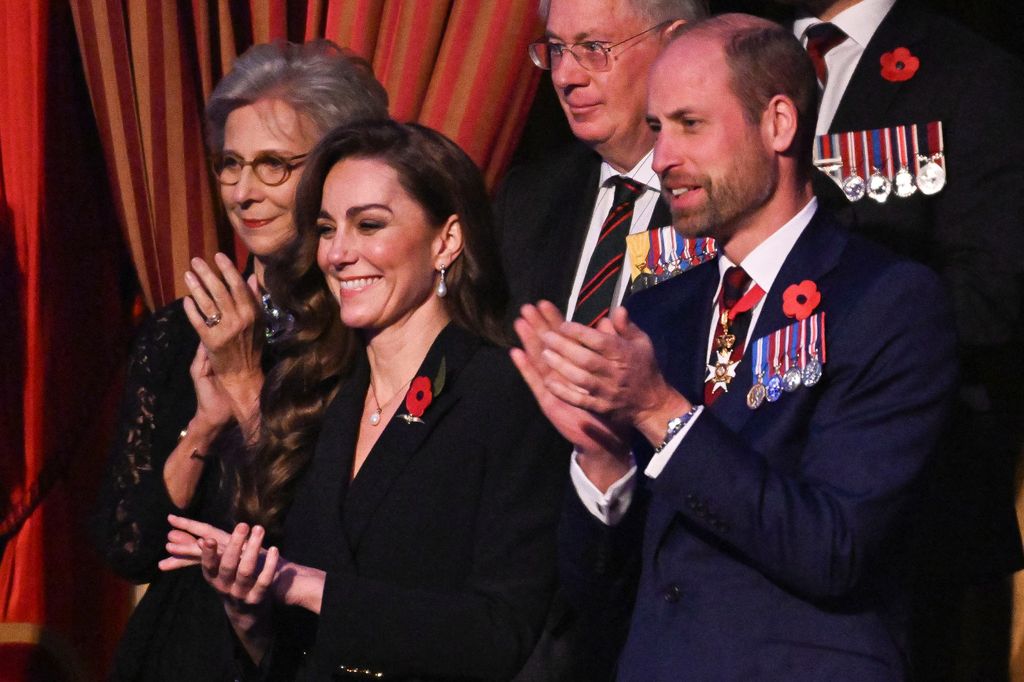 Britain's Catherine, Princess of Wales (L) and Britain's Prince William, Prince of Wales (R) attend "The Royal British Legion Festival of Remembrance" ceremony at Royal Albert Hall