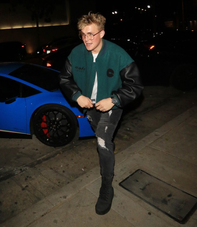 Jake Paul wearing black ripped jeans