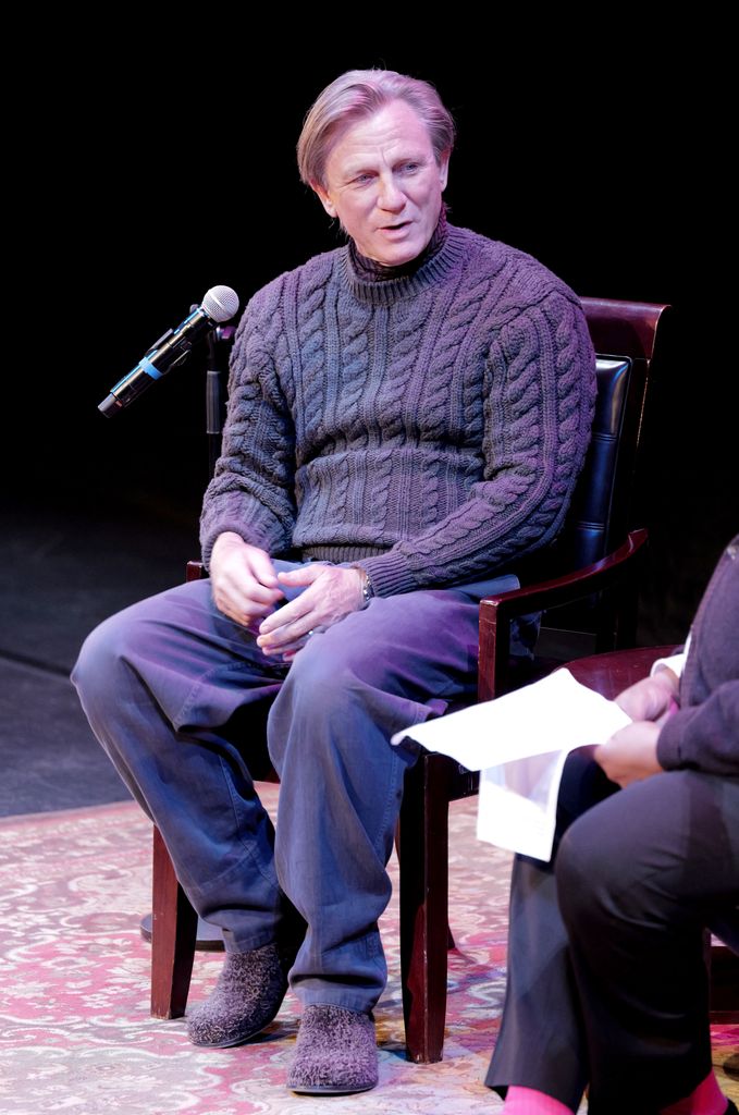 Daniel Craig sported a cosy sweater and slippers as he took to the stage for an event titled An Evening With Daniel Craig.

