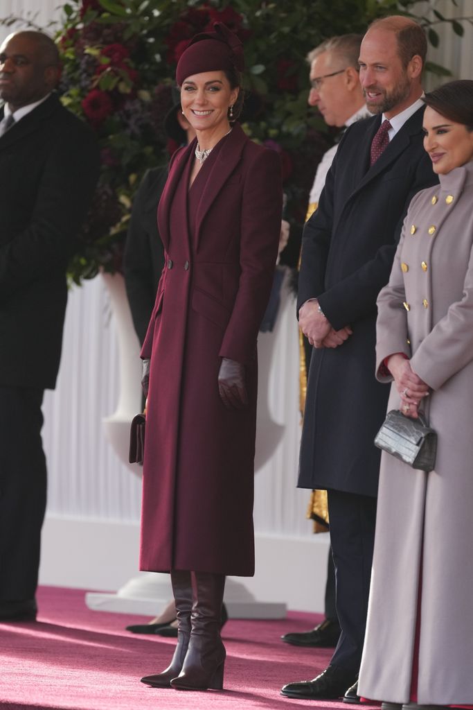 Kate's first outfit was an Alexander McQueen coat dess, leather boots and matching bag