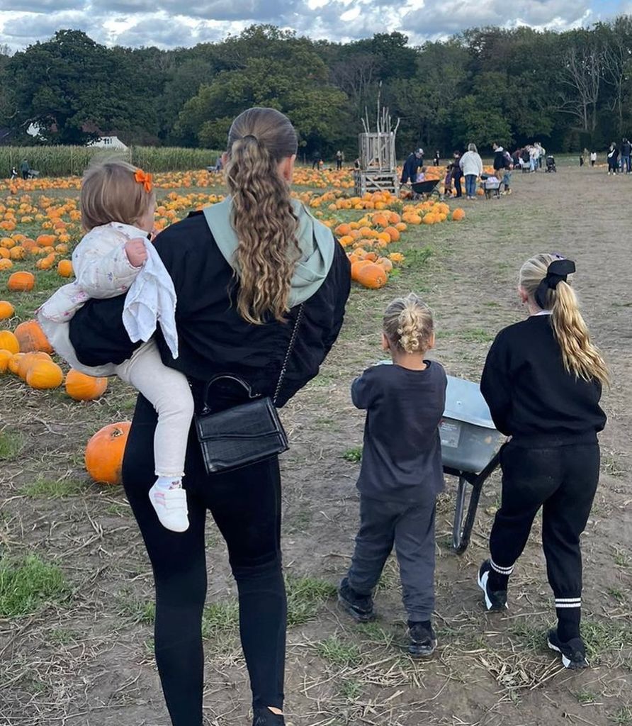 kids from behind at pumpkin patch