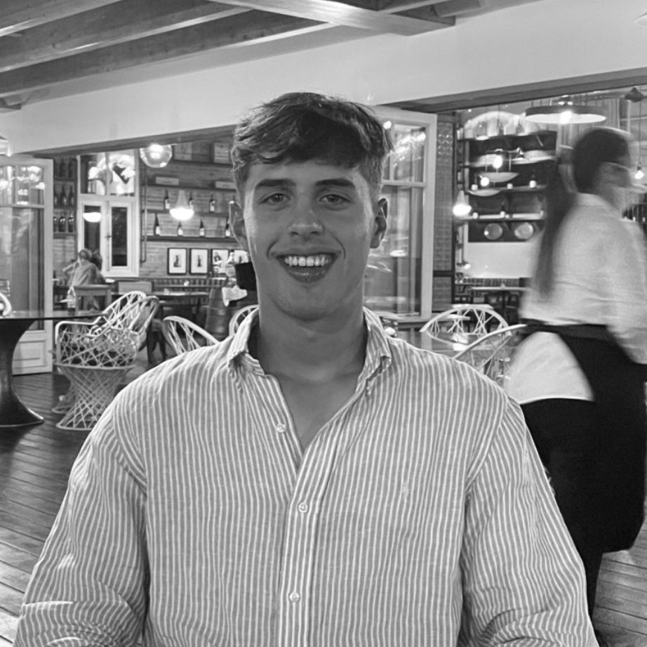 Black-and-white photo of Flynn Southgate at a restaurant table