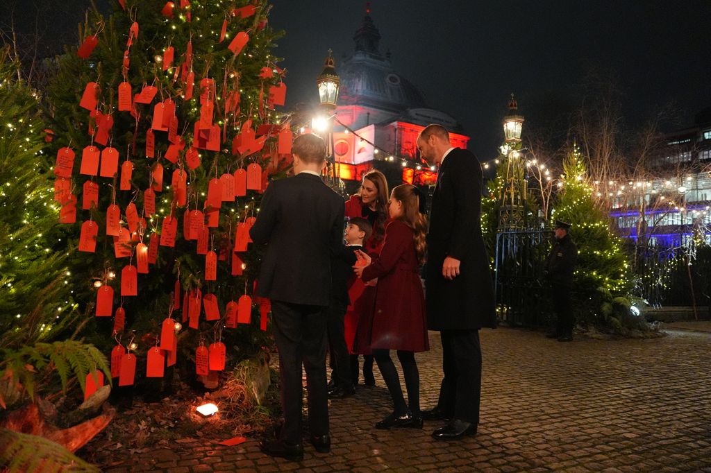 George, Charlotte and Louis placed their messages on the Kindness Tree