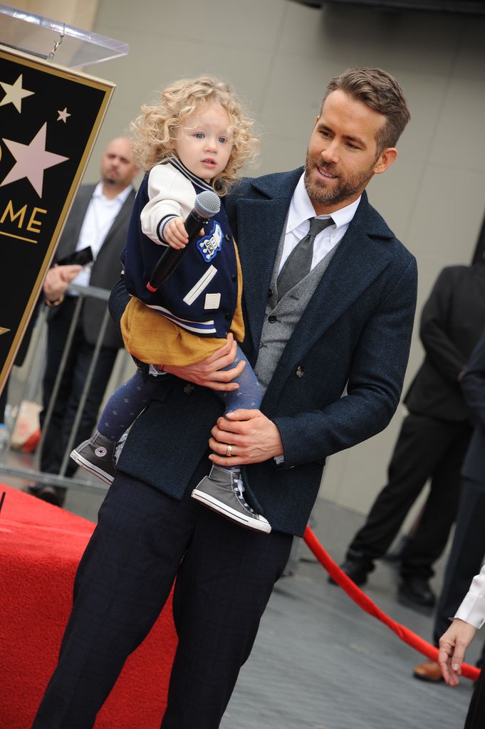 Actor Ryan Reynolds and daughter James Reynolds pose for a photo as Reynolds is honored with star on the Hollywood Walk of Fame on December 15, 2016 in Hollywood, California