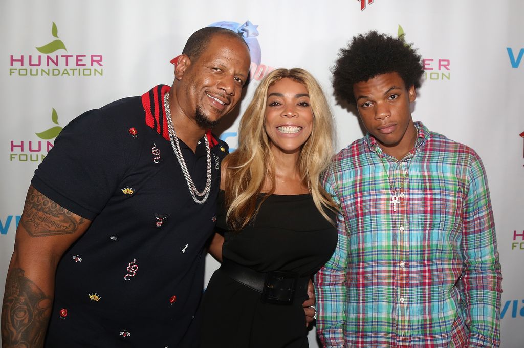 Kevin Hunter, wife Wendy Williams and son Kevin Hunter Jr pose at a celebration for The Hunter Foundation Charity 