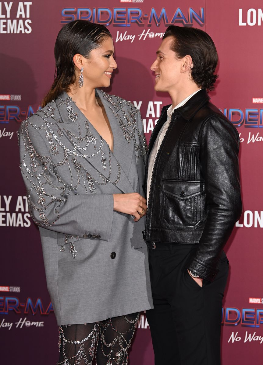 Zendaya and Tom Holland attend a photocall for "Spiderman: No Way Home" 