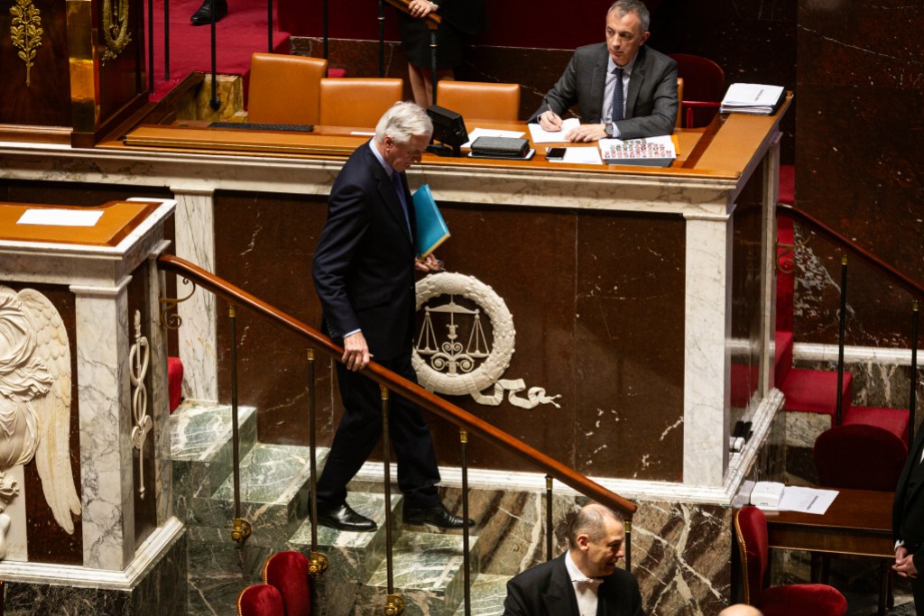 PARIS, FRANCE - 2024/12/04: French Prime Minister Michel Barnier seen after his speech on the discussion of the motion of censure at the National Assembly. The French National Assembly has adopted a motion of censure against Prime Minister Michel Barnier, deposing him after just three months in office. The motion was supported by the left-wing Nouveau Front Populaire coalition and the far-right Rassemblement National party, securing 331 votes in favor. This marks a significant political shift as the assembly ousts the head of government. (Photo by Telmo Pinto/SOPA Images/LightRocket via Getty Images)