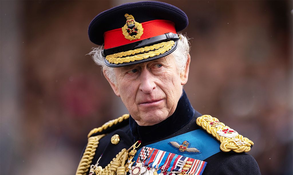 King Charles wearing his military uniform and looking pensive