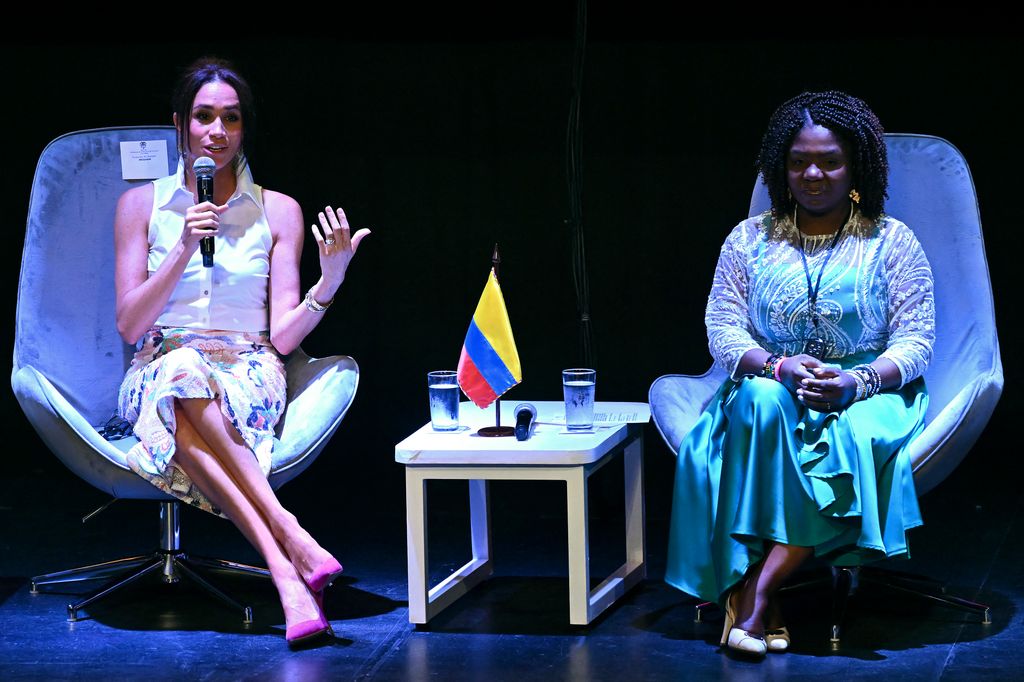 US actress Meghan Markle (L) addresses the audience next to Colombia's Vice-President Francia Marquez