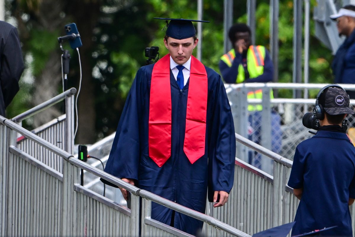 Barron Trump, son of Donald Trump and Melania Trump, takes part in his graduation at Oxbridge Academy in Palm Beach, Florida.