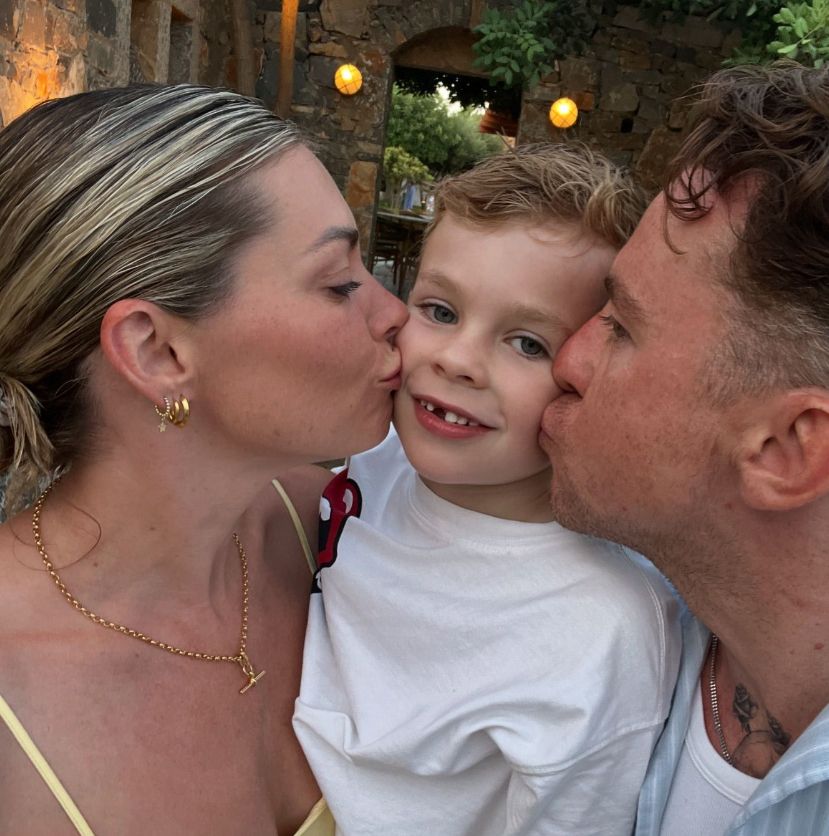 Georgia Horsley and Danny Jones kissing their son