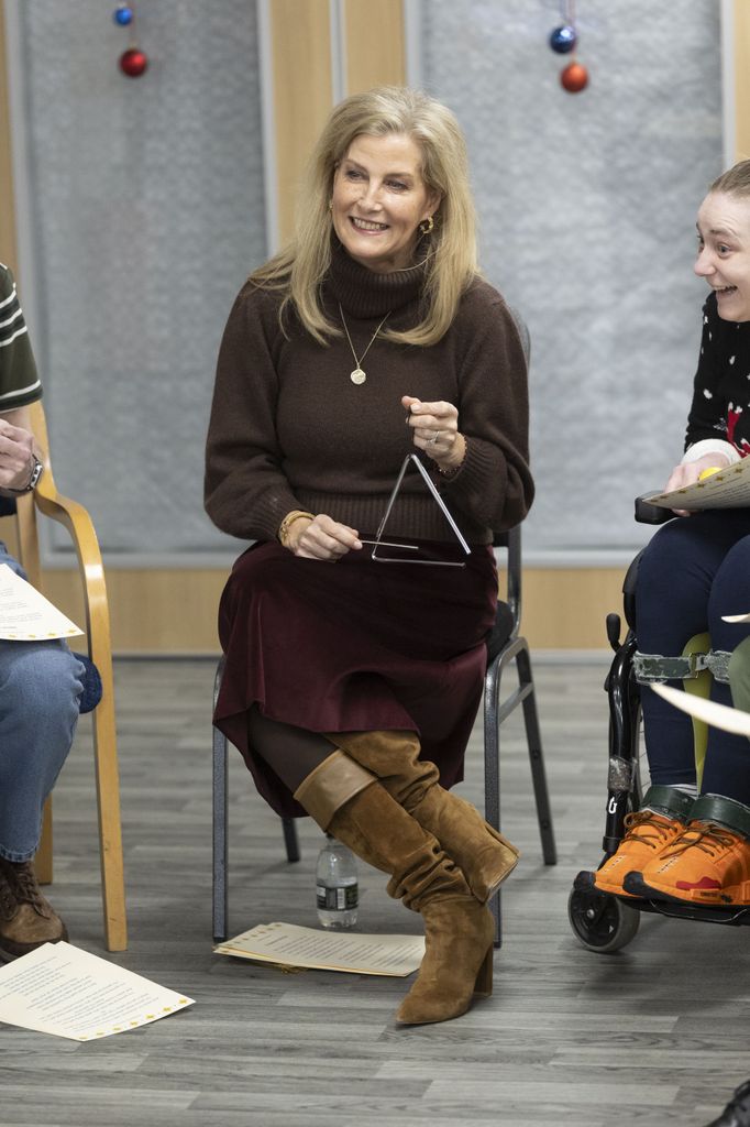 Sophie, Duchess of Edinburgh sitting playing triangle