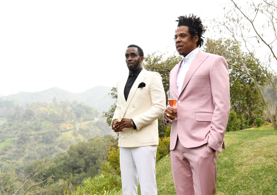 Sean Combs, left, and Jay-Z, who is holding a drink, in 2020.