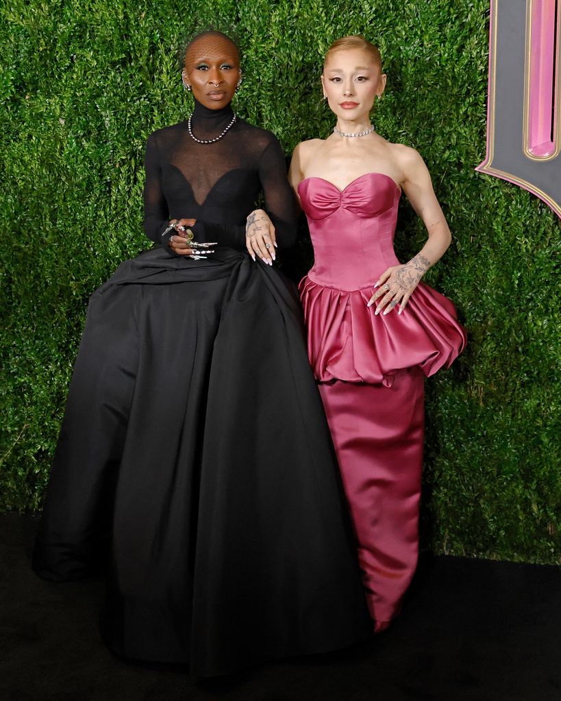 Cynthia Erivo in black gown and Ariana Grande  in pink gown